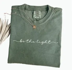 Comfort Colors Be The Light Shirt, Playful Christian Bible Verse Graphic Tee, Aesthetic Minimalist Religious Apparel, Trendy Woman's Bible Study Top