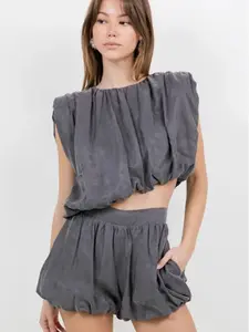 ASYMMETRICAL HEMMED WITH SHOULDER PAD WOVEN TOP - CHARCOAL Sleeveless Top with Unique Hem Design and Shoulder Pad Detailing