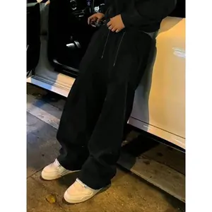 Trending on TikTok! Black baggy sweatpants featuring a loose fit and drawstring waist, perfect for achieving a stylish, casual streetwear look when paired with white sneakers