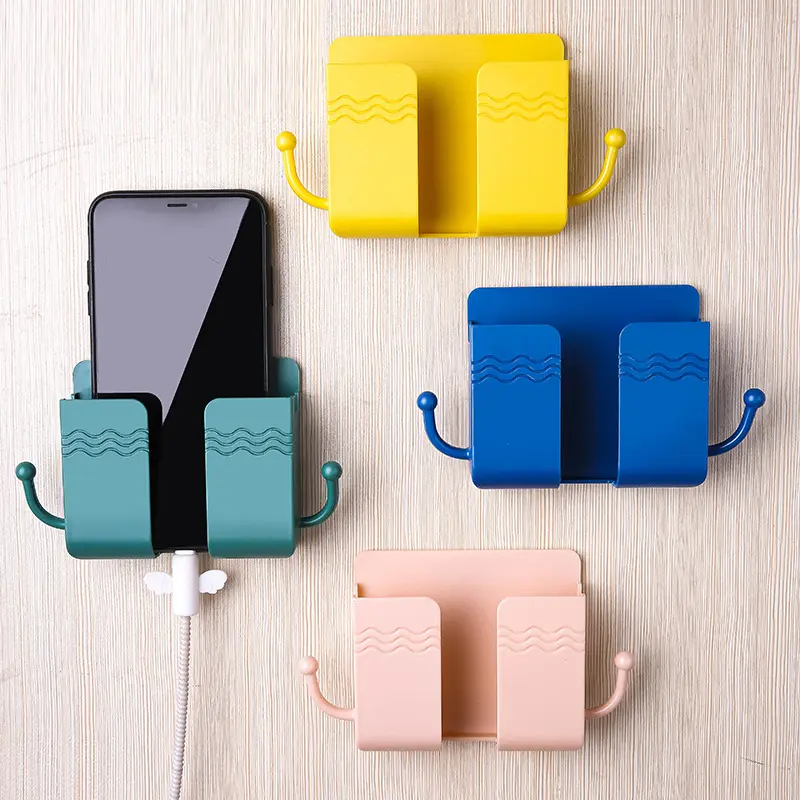 2 Pcs Wall Mount Phone Holder Adhesive Wall Phone Mount Charging Stand and Remote Control Stand Multipurpose Socket Pocket Universal Deck Storage Box for Bedroom, Kitchen, Bathroom, Office