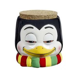 PENGUIN STASH JAR | Made of ceramic | Cork lid protects sensitive contents from light | 4" tall x 3 3/" long x 3 1/4 wide | Ideal to store teas, coffees, herbs, spices and medical herbs | Cool Gifts