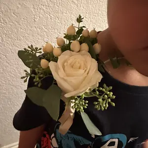 Boutonnières and corsages. These are made with roses for a dance.
