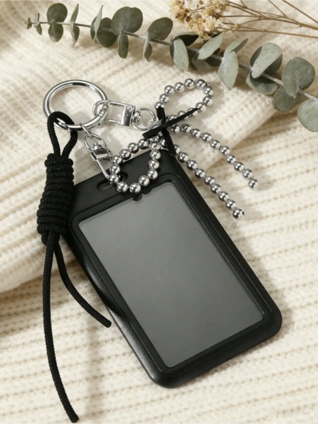Black card holder adorned with silver bead & pearl bow. Stores ID, cards and photos. Stylish bag accessory, ideal daily carry and gift for various occasions.