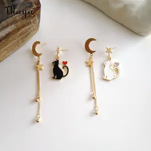 Thaya Asymmetric Star Moon Playful Cat Earrings