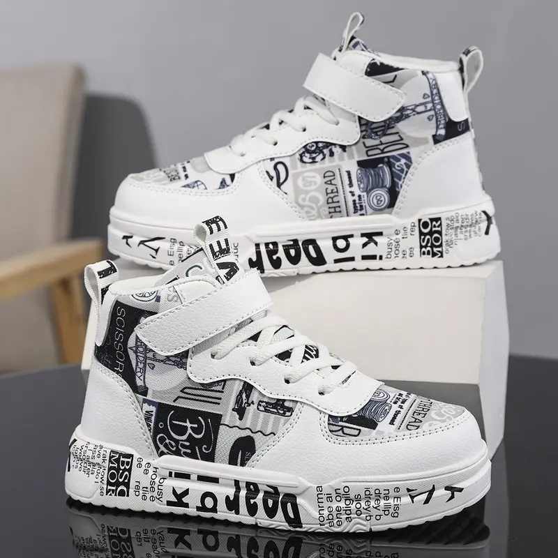 Kids’ trendy graffiti letter sneakers—soft cushioning that absorbs impact so kids don’t get tired when running and jumping; Velcro closure, no laces; unisex casual shoes for children.