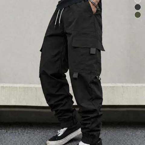 Men’s casual cargo pants with multiple pockets and a drawstring elastic waistband. Practical solid-color long pants that are skin-friendly and comfortable for everyday workouts and work. Cargo pants for home leisure—stock them year-round for all seasons.