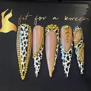 Cowprint w/ Gold Chrome Press on Nail Art set! Quality customized press on nails, High Gloss, Gel Polish, Long-lasting and easy to apply. Includes: 10 nails, application kit & instruction guide.