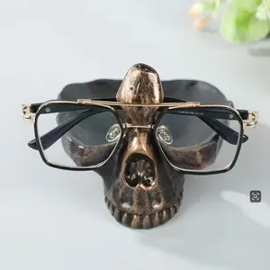 Brand new creative design skull eyeglass stand craft desktop decoration eyeglass display stand DIY jewelry storage tray home decoration