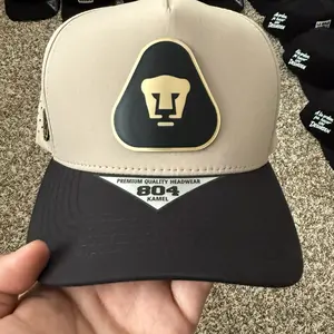 Pumas Unam Cap - Premium Quality Headwear Model - Black and Beige Design with Gold Logo