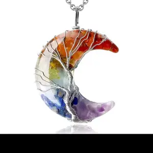 7 Chakra Tree Of Life Crescent Moon Necklace. Amplify your frequency and align with all chakras, tree of life overlay creates a never before seen energy container with numerous benefits while staying high fashion with the vibe.