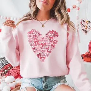Valentine’s Day Bow T-shirt or Sweatshirt, Pink Heart-Shaped Bow Pattern Pullover, Cute and Romantic Retro Valentine’s Day Shirt, Create a Fashionable Holiday Look GARMENTARY