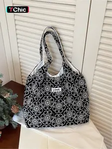 Relaxing Embroidered Flower Letter Logo Tote Bag | Simple silhouette+Embroidered flower fabric+Letter logo, with practical storage properties, suitable for daily commuting, short trips, school attire, business trips, etc., with a relaxed commuting style f