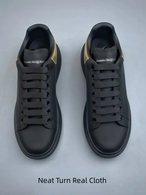 Low-top fashion platform shoe in full black with shiny gold heel panel. Easy to match jeans, dresses and casual bottoms.