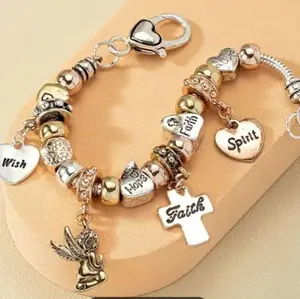 Faith-Based Bracket with Heart Charms, Prayer Cross, and Angel Charm, Featuring "Hope," "Faith,""Pray," and "Love" costume jewelry.
