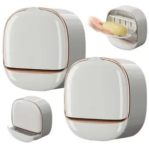 Modern wall-mounted soap dish with rose gold trim, white, plastic construction, and bathroom drainage design. (Includes snap-on adhesive strip)