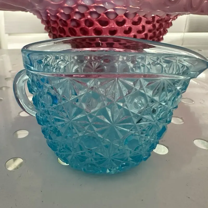 Button and daisy creamer glass