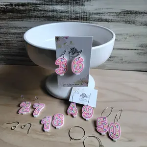 Customizable Pink Birthday Candle Earrings on white acrylic