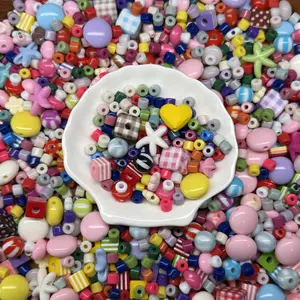Colorful Acrylic DIY Mixed Bead Set with uniquely shaped beads and matching accessories. This exquisite DIY bead art kit is perfect for crafting daily ornaments including bracelets and phone charms.