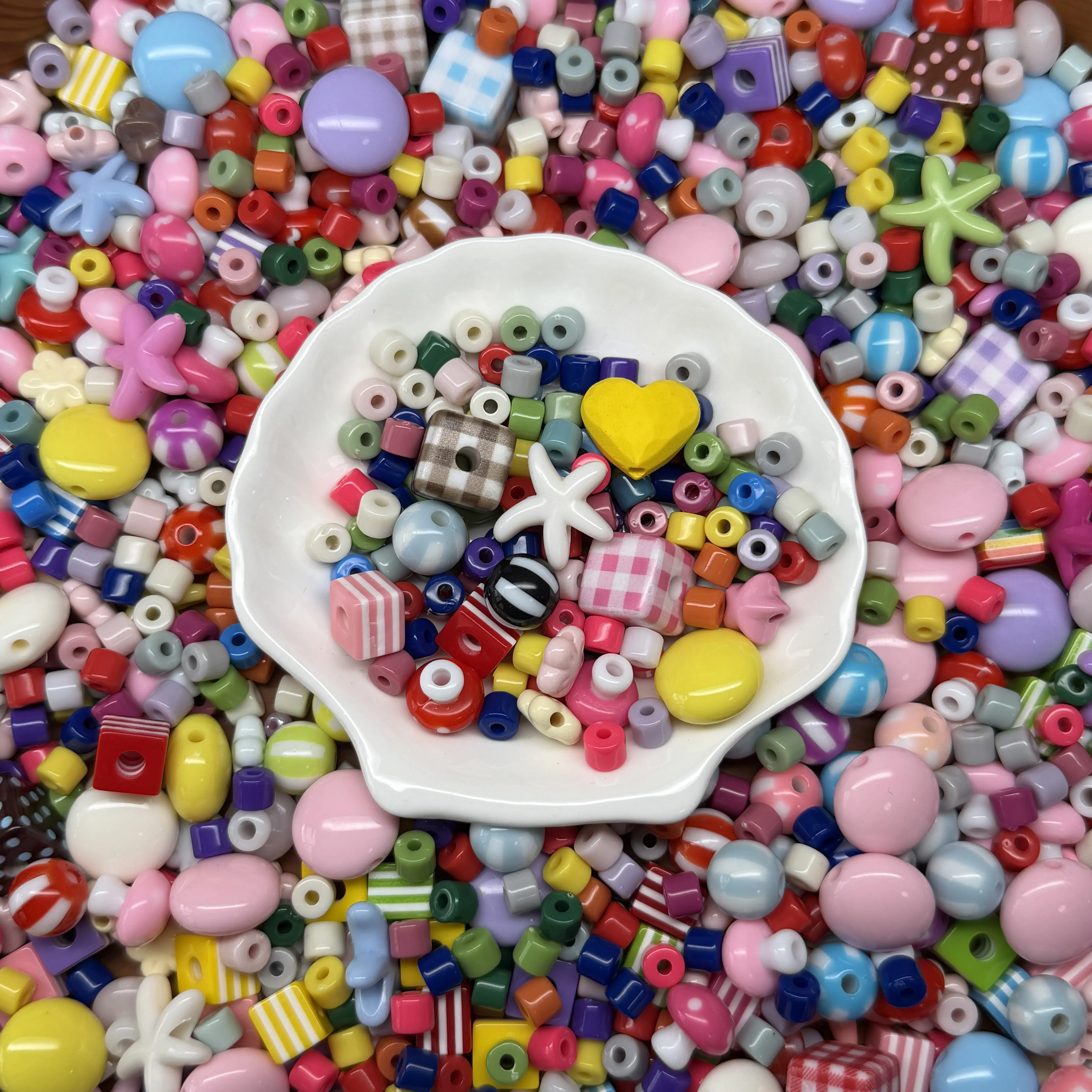 Colorful Acrylic DIY Mixed Bead Set with uniquely shaped beads and matching accessories. This exquisite DIY bead art kit is perfect for crafting daily ornaments including bracelets and phone charms.