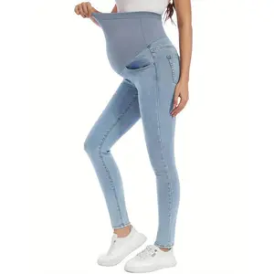 High-waisted skinny stretch denim jeans for pregnant women with a fitted over-the-belly design and pockets