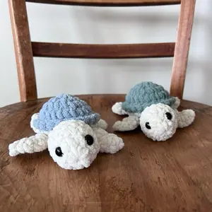 The Cutest Crocheted Turtle Rattles - Adorable Blue and White Designs for Delightful Decoration