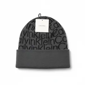 Calvin Klein Allover Logo Cuff Hat Dark Grey Cozy Designer Beanie Style Soft Warm Unisex Winter Accessory
