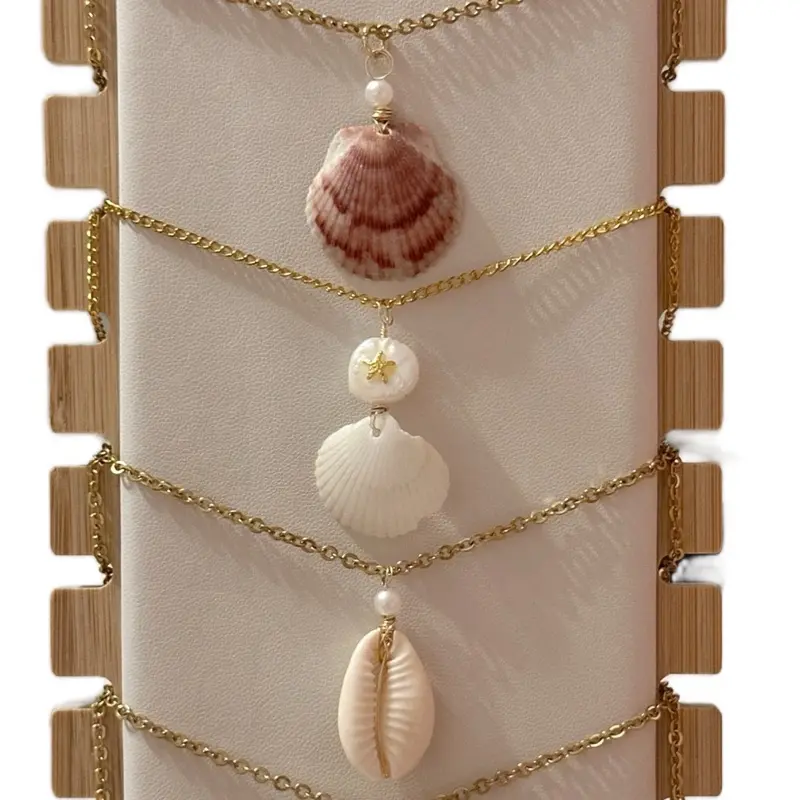 Handmade beach inspired jewelry + made with seashells and sharks teeth