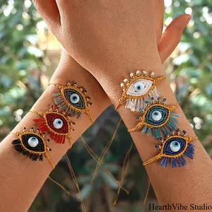 HearthVibe Studio Hand-Woven Evil Eye Sports Wristband Bracelet, Ethnic Tassel Design, Unisex Sports Accessory, Modern Fashion Accessories for Women