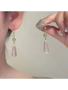A pair of simple and elegant pink resin drop earrings