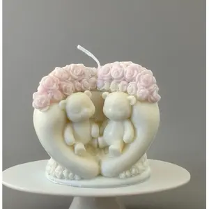 Handmade Soy Candle in the Shape of a Fist Holding Two Small Bears with Rose Wreath Decor
