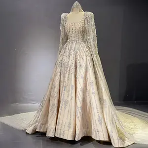 Dubai Starlight: Luxurious Nude Evening Dress with Crystal Embellishments and a Graceful Cape, Perfect for Wedding Parties, Engagements, and Prom.