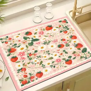 A dish drying pad with pink patterns of strawberries and sunflowers, suitable as a countertop absorbent pad for drying kitchen supplies, bathroom items, and dishes. oven mat