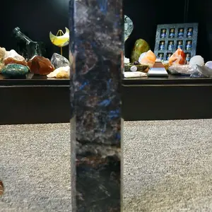 Astrophyllite Firework Crystal - Mother Nature's Sparkling Star-Like Specimen Displayed on Carpeted Surface for Spiritual Growth and Intuition Enhancement