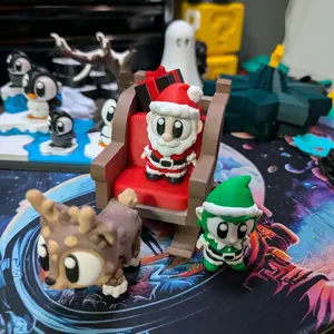 3D Printed Santa in his sleigh with presents, an elf and a reindeer.