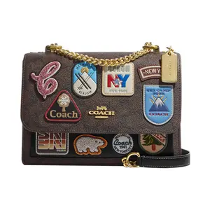 COACH Klare 22 Monogram Print Cartoon Embellished Snap Closure Canvas and Leather Crossbody Bag for Women, Khaki and Black