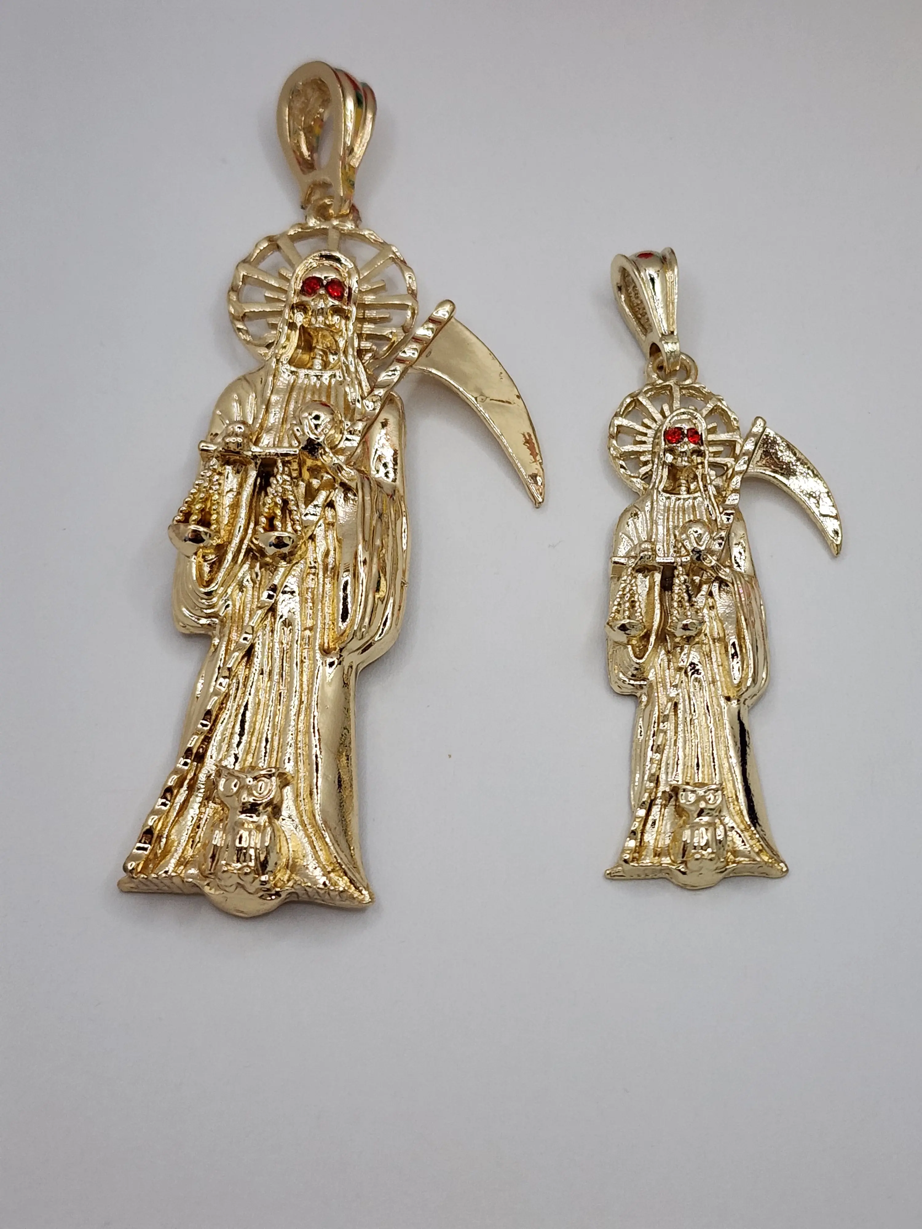 the grim reaper set of 2 pendants gold played red eyed