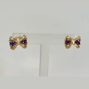 B74. Mini Bow Stud Earrings/laminado 14k