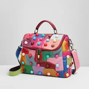 A Handbag Featuring a Geometric Design, Equipped with a Removable Shoulder Strap, Zip Closure, And Lining. This Versatile And Roomy Messenger Bag Showcases Random Patchwork And Rivet Embellishments, Making It Ideal for Everyday Use And Commuting