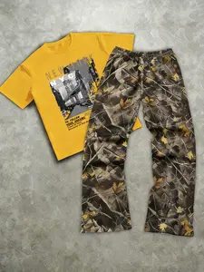 The men's two-piece set includes a short-sleeved T-shirt with a print of letters and street scenes and a pair of long pants; made of knitted fabric; suitable for everyday wear and all seasons. Menswear