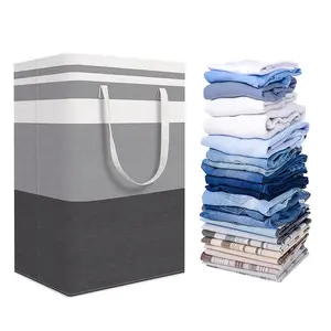 Collapsible laundry basket, used for storing dirty clothes, Laundry Organizer, featuring a striped fabric design. It is very suitable for storing laundry and toys in dormitories and homes, with a spacious capacity and extended handles.