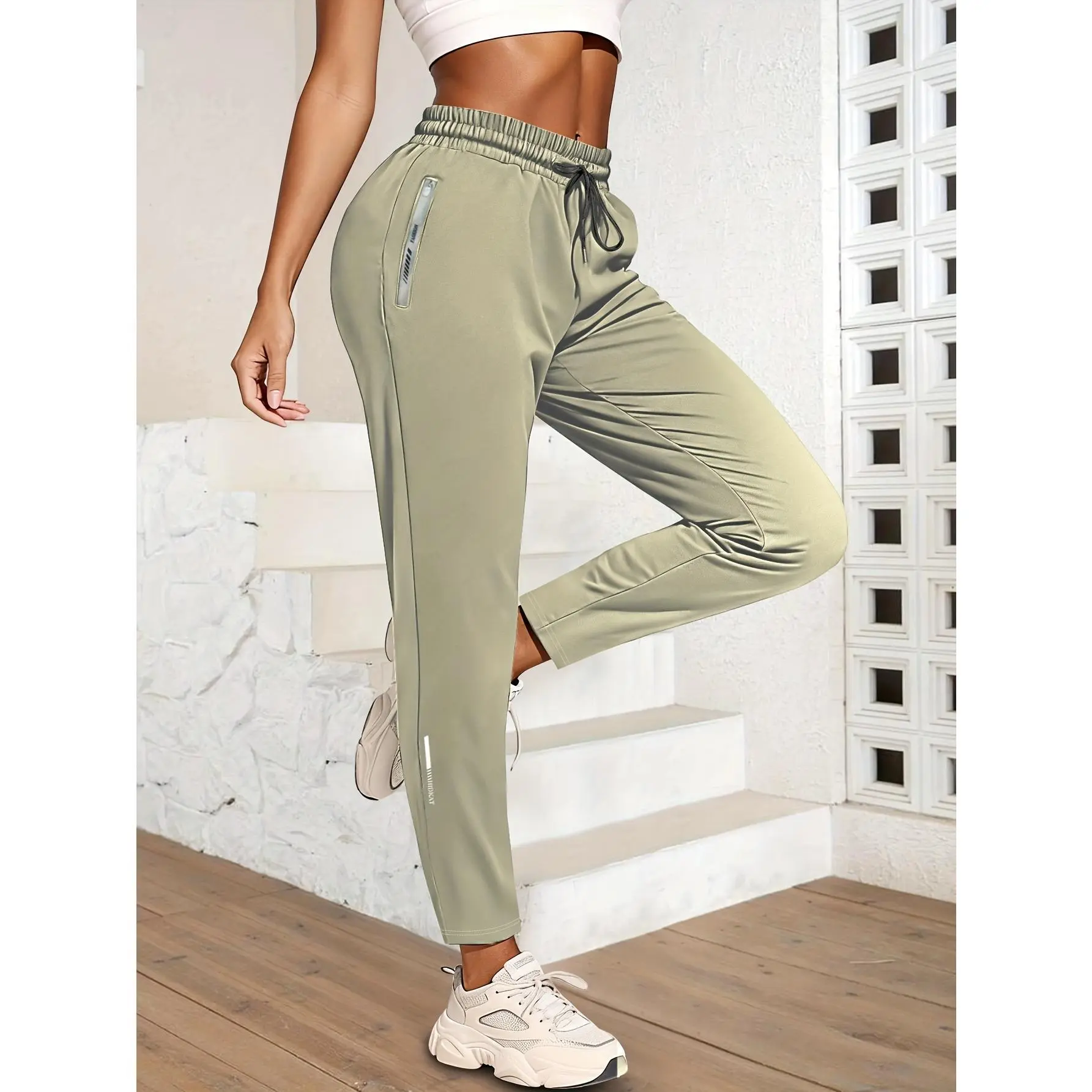 Women's High-Elastic Ice Sliky Fiber Fabric Sports Pants, with zipper pockets, high-elastic material, lightweight and comfortable, solid color sportswear style, suitable for exercise and leisure, running pants