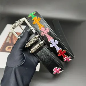 Edgy Y2K Gothic Cross Embossed White Leather Belt, Silver Hardware Punk Streetwear Waist Belt, Adjustable Unisex Pebbled Pattern Roller Belt with Detailed Buckles, Trendy Youth Style Statement Fashion Accessory for Jeans & Street Outfits