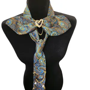 Blue and Gold Paisley Print Tie and Bow Combo with Elegant Heart Brooch for Stylish Outfits