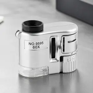 Portable LED Illuminated Handheld Magnifier: Mini Pocket Microscope for Jewelry, Coins, Stamps & Antique Watch Inspection. HD Lens, Diamond & Currency Detection Tool, Compact Travel-Friendly High Magnification Kit for Collectors.