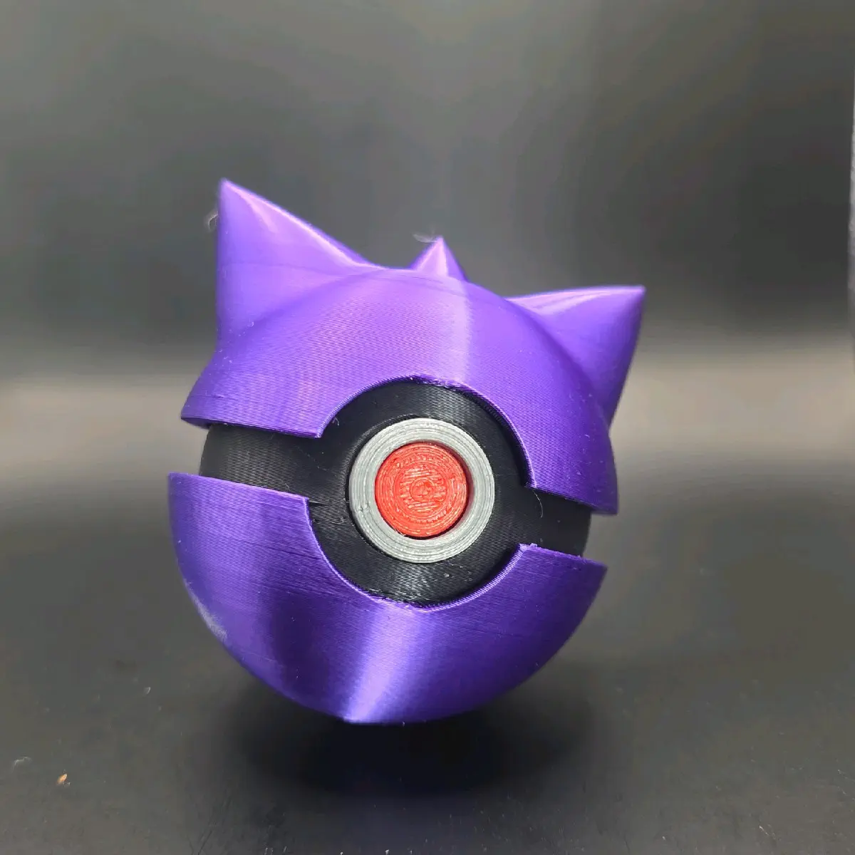 Gangar Pokeball - Purple Color, Character Design, Round Shape, Features Textured Surface, Ideal for Collecting and Play
