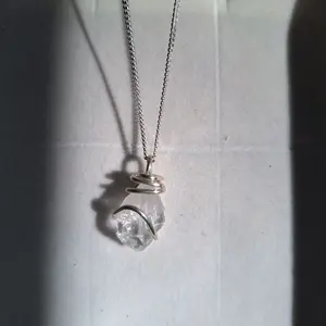 Clear Quartz Crystal wrapped in 100% Sterling Silver, includes 100% sterling silver chain.