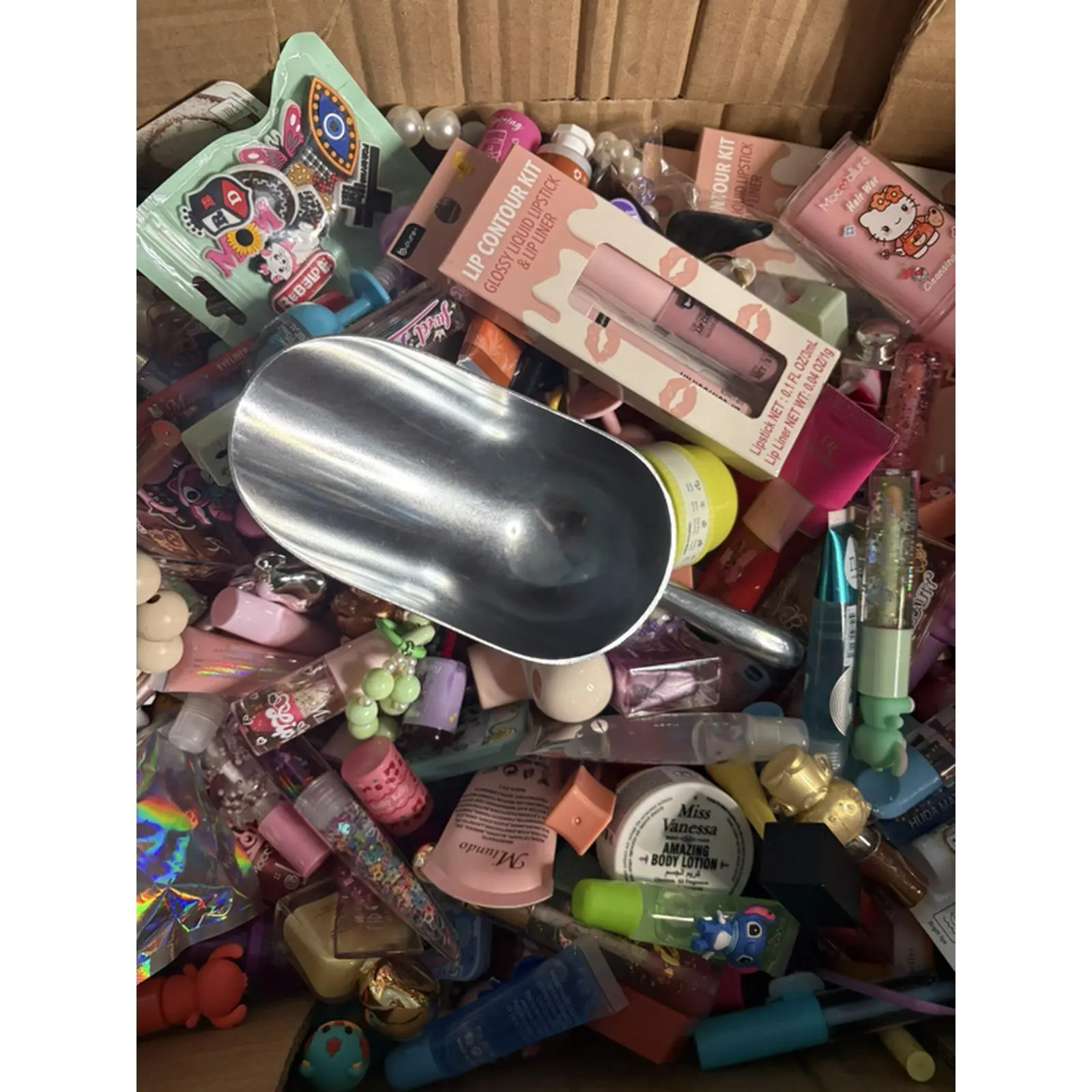 Cosmetic Collection Box with Various Makeup Items and Accessories for Beauty Enthusiasts