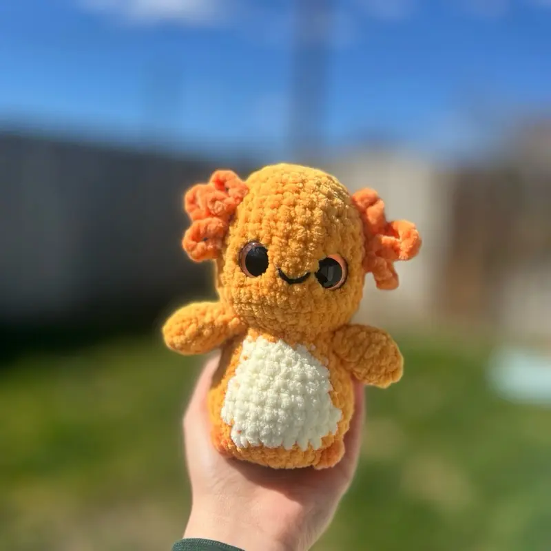 Handmade crochet orange axolotl