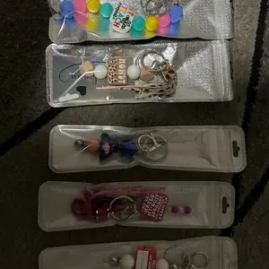 Pens for writing keychains for bags and backs etc and a coming soon addition binky clips