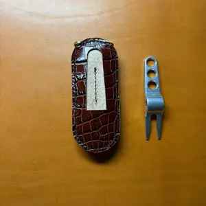 Scotty Cameron Pivot Tool & Golf Tee Holder. Pocket for 1.5 inch Ball Marker. Embossed Crocodile and Natural Veg Tan leather.